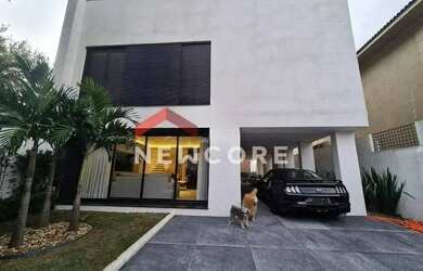 Imagem: A casa possui 4 Dormitórios, 5 Banheiros, 4 Vagas na garagem