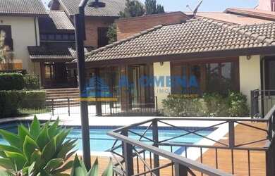 Imagem: A casa possui 4 Dormitórios, 5 Banheiros, 4 Vagas na garagem