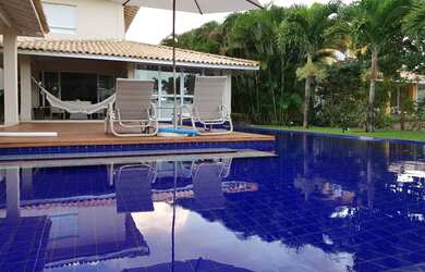 Imagem: A casa possui 3 Dormitórios, 4 Banheiros, 4 Vagas na garagem