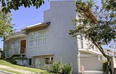 Imagem: A casa em condomínio possui 4 Dormitórios, 3 Banheiros, 4