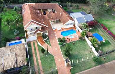 Imagem: A casa em condomínio possui 5 Dormitórios, 5 Banheiros, 5