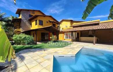 Imagem: A casa possui 4 Dormitórios, 4 Banheiros, 4 Vagas na garagem