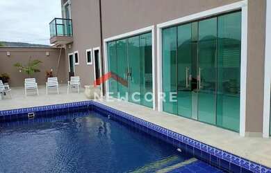 Imagem: A casa possui 4 Dormitórios, 5 Banheiros, 3 Vagas na garagem