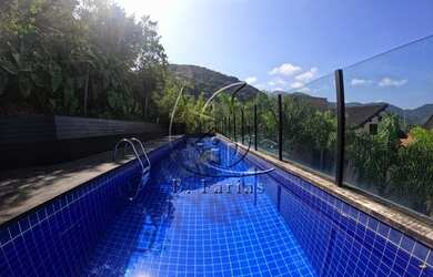 Imagem: A casa em condomínio possui 4 Dormitórios, 5 Banheiros, 3