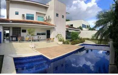 Imagem: A casa em condomínio possui 4 Dormitórios, 5 Banheiros, 4