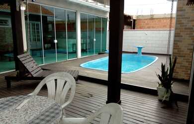 Imagem: A casa possui 2 Dormitórios e 1 Vaga na garagem e está localizado