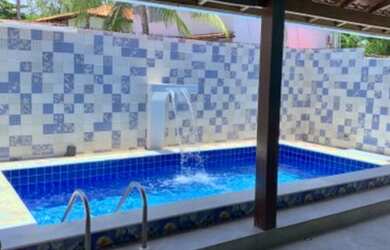 Imagem: A casa à venda possui 3 Dormitórios e 3 Vagas na garagem e