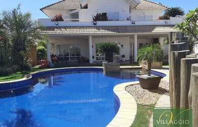 Imagem: A casa em condomínio possui 4 Dormitórios, 5 Banheiros, 4