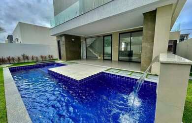 Imagem: A casa possui 4 Dormitórios, 5 Banheiros, 4 Vagas na garagem