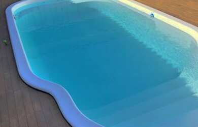 Imagem: A casa possui 3 Dormitórios e 3 Vagas na garagem e está localizado