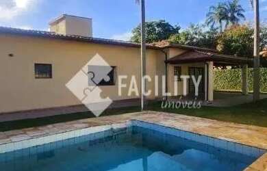 Imagem: A casa possui 4 Dormitórios, 5 Banheiros, 4 Vagas na garagem