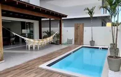 Imagem: A casa em condomínio possui 5 Dormitórios, 5 Banheiros, 500m²