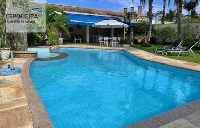 Imagem: A casa em condomínio possui 5 Dormitórios, 5 Banheiros, 4