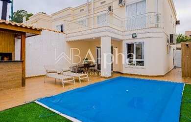 Imagem: A casa em condomínio possui 4 Dormitórios, 3 Banheiros, 2