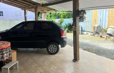 Imagem: A casa possui 2 Dormitórios, 2 Banheiros, 3 Vagas na garagem