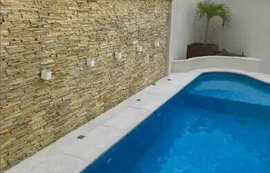 Imagem: A casa em condomínio possui 5 Dormitórios, 5 Banheiros, 4