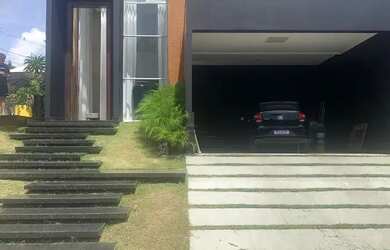 Imagem: A casa possui 4 Dormitórios, 5 Banheiros, 4 Vagas na garagem