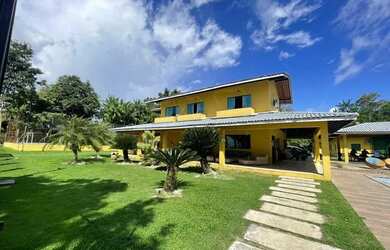 Imagem: A casa possui 5 Dormitórios, 5 Banheiros, 5 Vagas na garagem