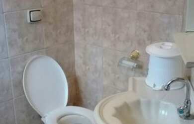 Imagem: A casa possui 3 Dormitórios, 2 Vagas na garagem e está localizado