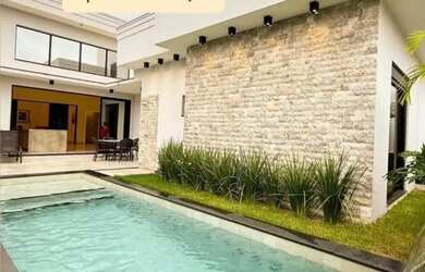 Imagem: A casa em condomínio possui 4 Dormitórios, 4 Banheiros, 2