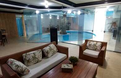 Imagem: A casa possui 5 Dormitórios, 5 Banheiros, 5 Vagas na garagem