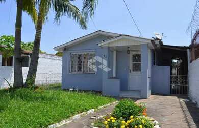 Imagem: A casa possui 3 Dormitórios, 1 Banheiro, 1 Vaga na garagem