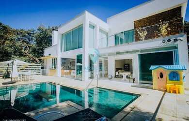 Imagem: A casa possui 5 Dormitórios, 5 Banheiros, 5 Vagas na garagem