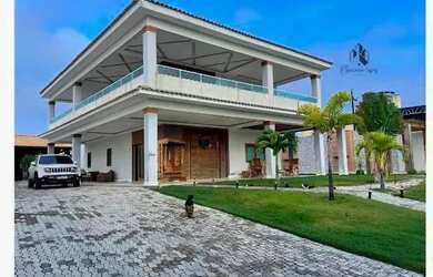 Imagem: A casa possui 5 Dormitórios, 5 Banheiros, 5 Vagas na garagem