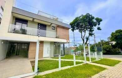 Imagem: A casa possui 3 Dormitórios, 5 Banheiros, 2 Vagas na garagem