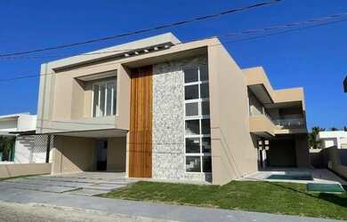 Imagem: A casa possui 4 Dormitórios, 5 Banheiros, 4 Vagas na garagem