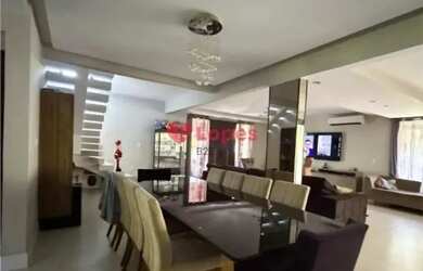 Imagem: A casa possui 4 Dormitórios, 3 Banheiros, 5 Vagas na garagem