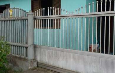 Imagem: A casa possui 4 Dormitórios, 3 Banheiros, 5 Vagas na garagem