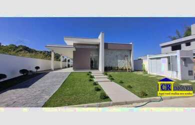 Imagem: A casa possui 4 Dormitórios, 1 Banheiro, 1 Vaga na garagem