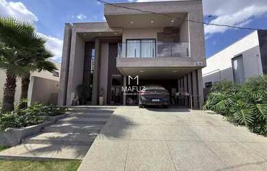 Imagem: A casa possui 4 Dormitórios, 5 Banheiros, 296m² de Área e