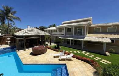 Imagem: A casa possui 5 Dormitórios, 5 Banheiros, 5 Vagas na garagem