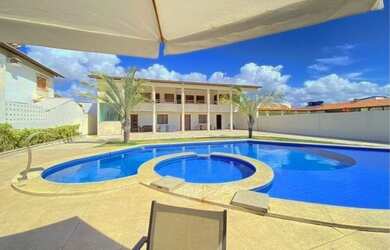 Imagem: A casa possui 4 Dormitórios, 3 Vagas na garagem e está localizado