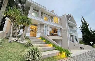 Imagem: A casa em condomínio possui 4 Dormitórios, 4 Banheiros, 4