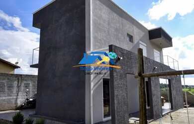 Imagem: A casa possui 3 Dormitórios, 5 Banheiros, 2 Vagas na garagem