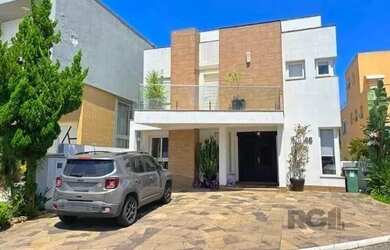 Imagem: A casa possui 3 Dormitórios, 3 Banheiros, 2 Vagas na garagem