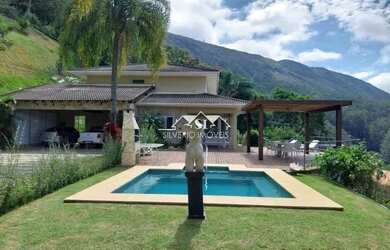 Imagem: A casa em condomínio possui 5 Dormitórios, 5 Banheiros, 3