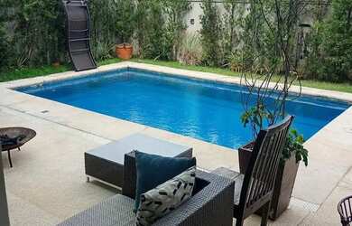 Imagem: A casa em condomínio possui 4 Dormitórios, 5 Banheiros, 4