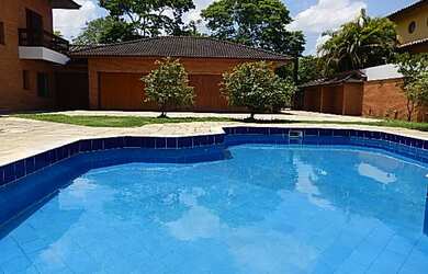 Imagem: A casa em condomínio possui 4 Dormitórios, 5 Banheiros, 3