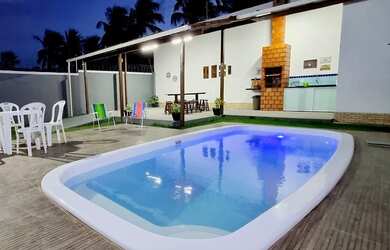 Imagem: A casa possui 5 Dormitórios, Acomodam 20 pessoas, 5 Vagas na