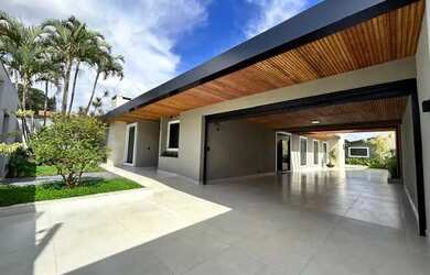 Imagem: A casa possui 3 Dormitórios, 5 Banheiros, 5 Vagas na garagem