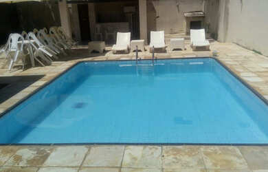 Imagem: A casa possui 4 Dormitórios e 5 Vagas na garagem e está localizado