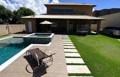 Imagem: A casa possui 5 Dormitórios, 4 Vagas na garagem e está localizado