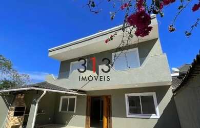 Imagem: A casa possui 4 Dormitórios, 4 Banheiros, 2 Vagas na garagem