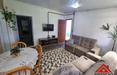 Imagem: A casa possui 4 Dormitórios, 2 Banheiros, 2 Vagas na garagem