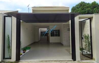 Imagem: A casa possui 3 Dormitórios, 2 Banheiros, 2 Vagas na garagem