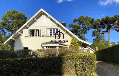 Imagem: A casa possui 5 Dormitórios, 5 Banheiros, 4 Vagas na garagem